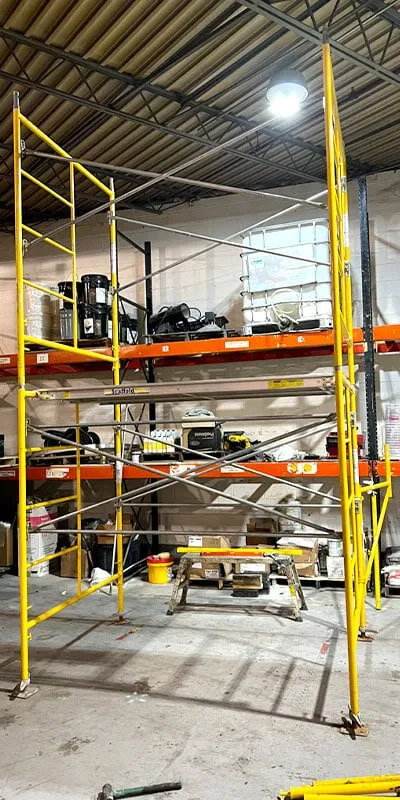 Yellow scaffolding set up in the Field Services work area