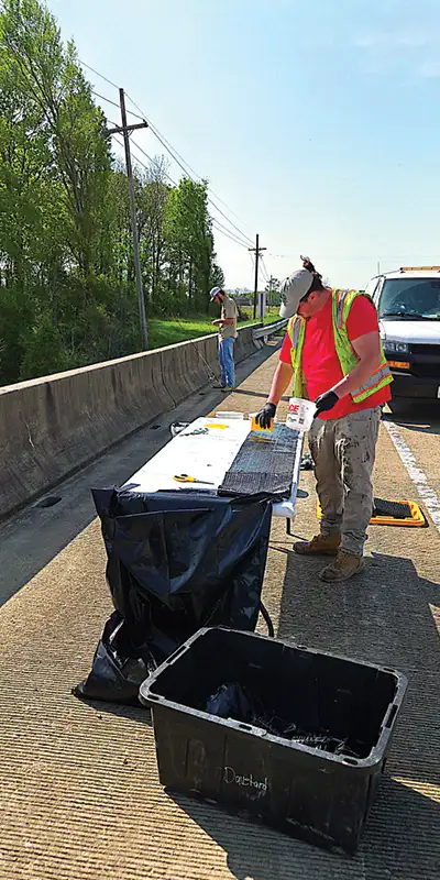 Applying epoxy to the fabric of this composite repair system