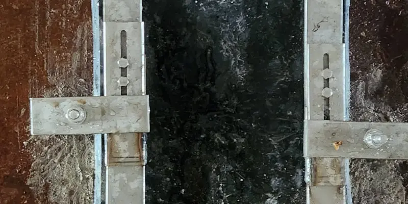 HydraTite installed with hold-downs to apply pressure to straight portions of pipe wall