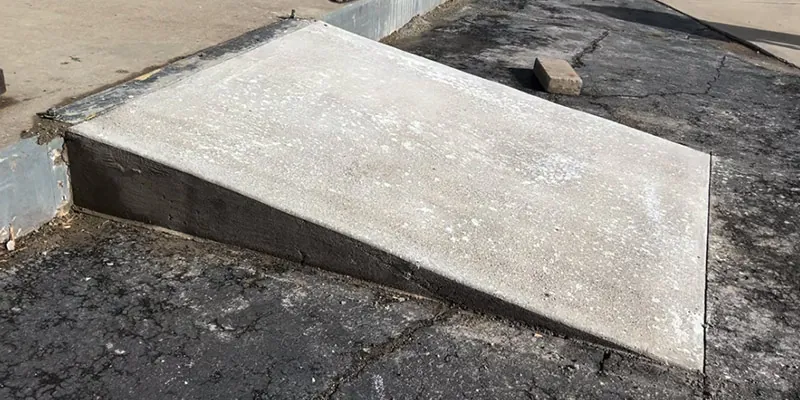 A newly laid concrete ramp