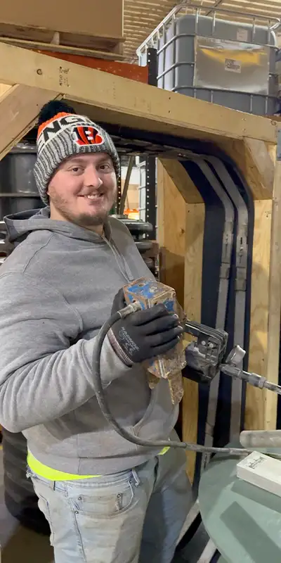 Dave holding the Hydraulic expander near a box-seal demo