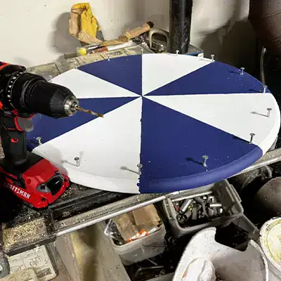 Tools being used to build a spinning wheel