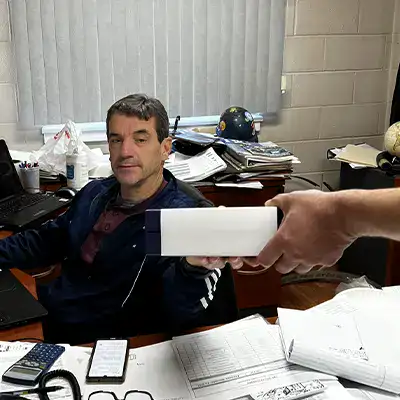 Mike Fox being passed a plague