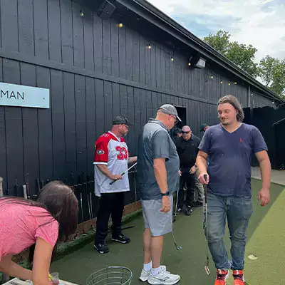 Several HydraTech employees going putt putting