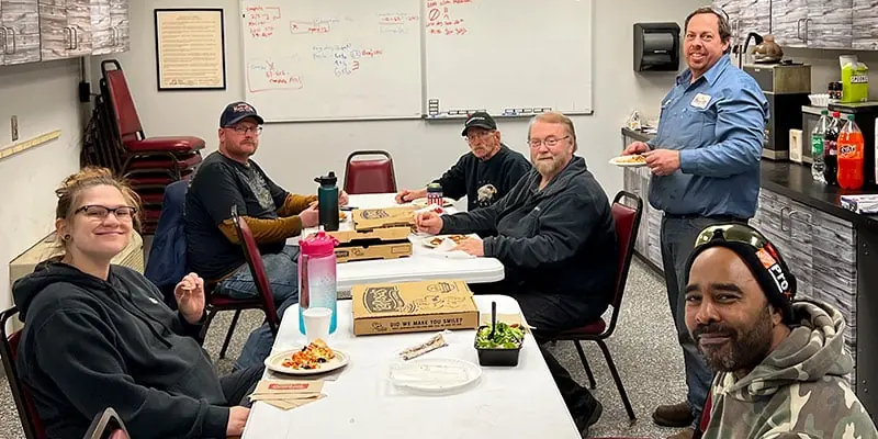 HydraTech gathering for lunch in the break room