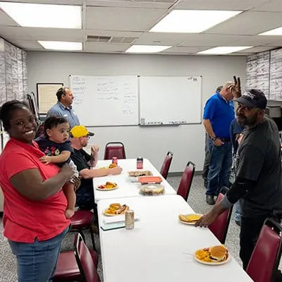 HydraTech gathering for lunch in the break room