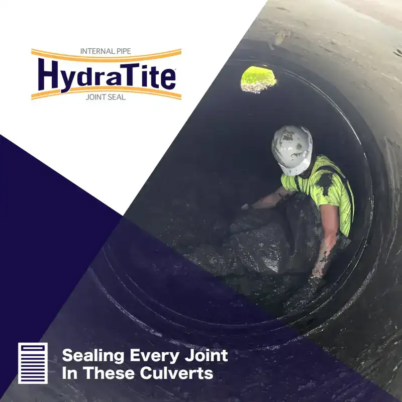 A technician sitting in a muddy pipe near a newly installed HydraTite Internal Pipe Joint Seal