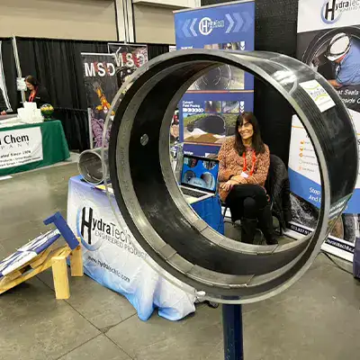 Jennifer sitting at the OTEC booth for HydraTech