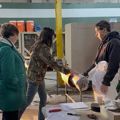 Several employees taking part in a HydraWrap application demonstration