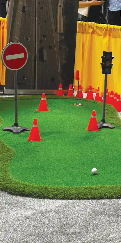 A mini golf course set up at a tradeshow