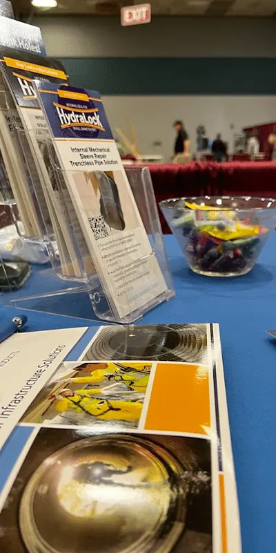 A table covered in all things HydraTech at the APWA tradeshow