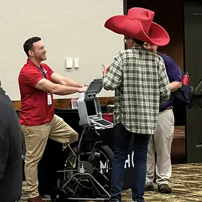 A guy with a massive red cowboy hat