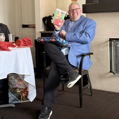 Peter Blais opening a Christmas card at the yearly HydraTech lunch
