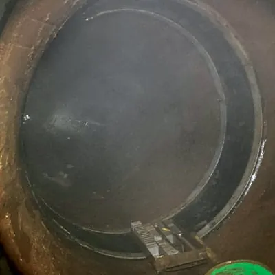 A HydraTite joint seal installed inside a pipe near a bend in the pipe