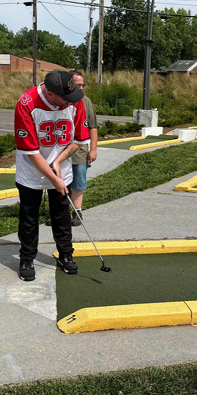 Rob playing putt putt