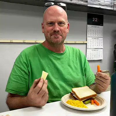 Rob sitting with a full plate at lunch