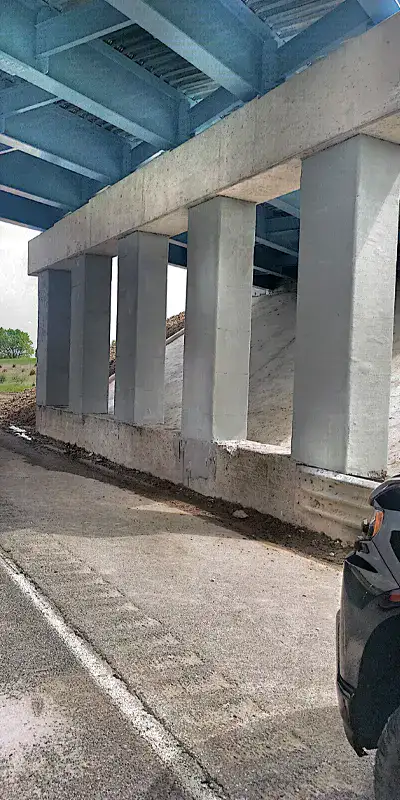 Several bridge columns that have been reinforced with fiber wrap