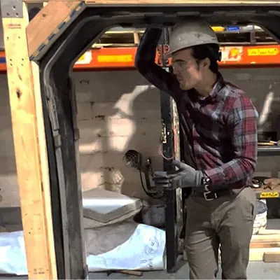 Caleb standing in a demo HydraTite installation explaining how this installation type is different from others