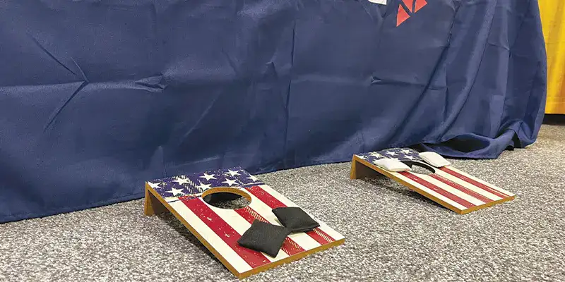 A pair of corn hole boards with American flags painted on them