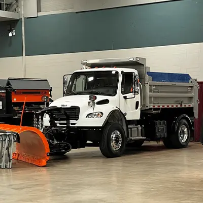 A large truck on display at a APWA trade show