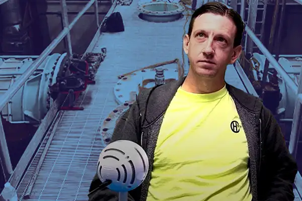 A field services crew member sitting in front of a water treatment facility