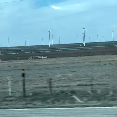 Wind mills off in a field