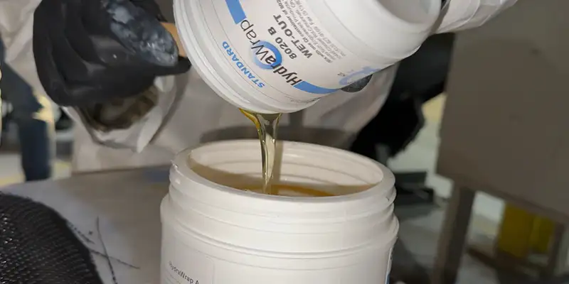 Mixing the components of HydraWrap's epoxy