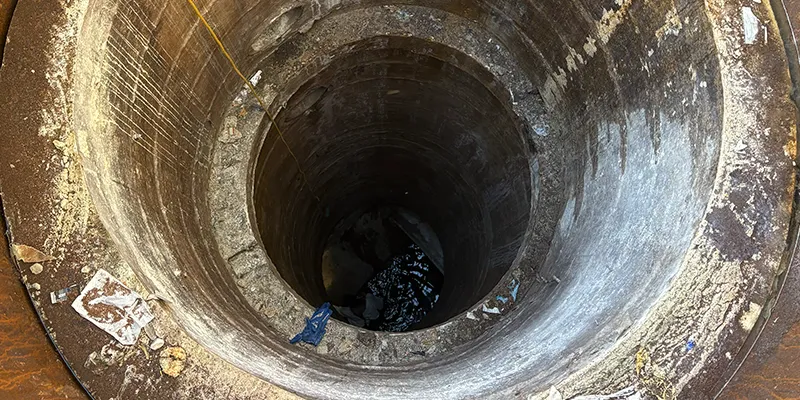 looking down into a long dark pipe