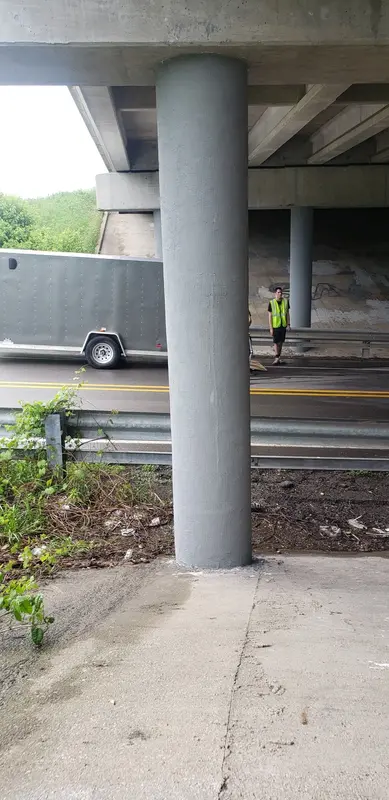 A bridge column that has been wrapped in carbon fiber
