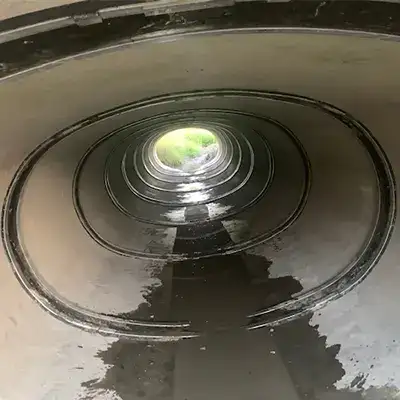 Inside an elliptical pipe with HydraTite installed over the joints