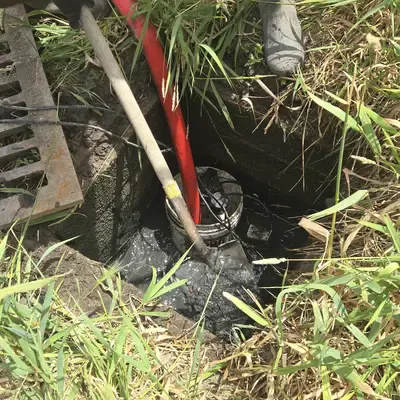 A culvert being cleaned out with a jetter vac