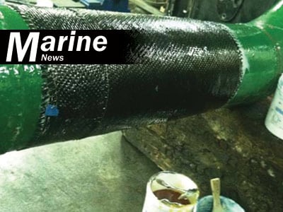 HydraWrap applied to the exterior of a green pipe to reinforce it