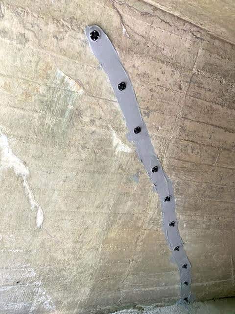 Cracks in concrete being injected with epoxy and polyurethane