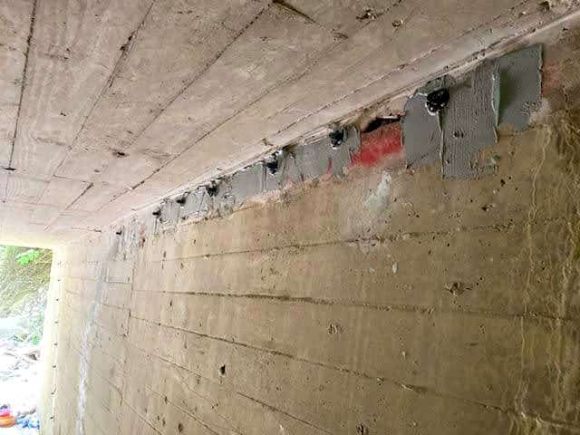 Cracks in concrete being injected with epoxy and polyurethane