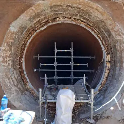 A portion of pipe interior being prepared for a HydraTite installation
