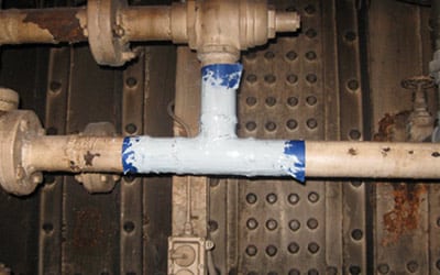 A tee fitting coated in epoxy