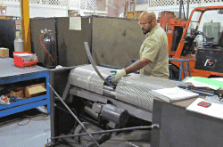 A retaining band being rolled to the correct diameter