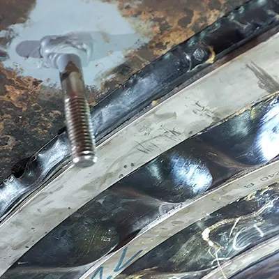 A stud installed on the side of a HydraTite internal pipe joint seal that is installed atop a penstock pipe joint