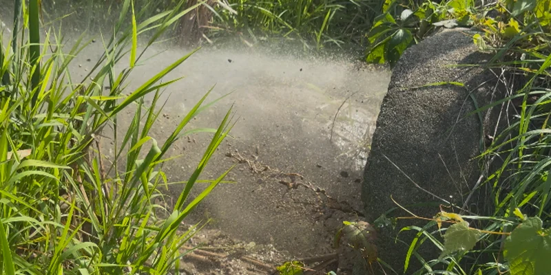 A culvert having debris cleared out with a jettervac