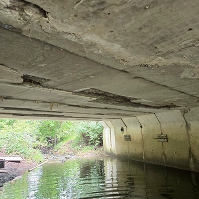 The underside of a bridge that is being patched